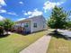 Charming home exterior with a manicured lawn, landscaped garden, walkway, and inviting porch at 1605 Appledale Ct # 116, Fort Mill, SC 29715