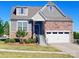 Charming two-story home with brick and siding, well-maintained lawn, and two-car garage at 1605 Appledale Ct # 116, Fort Mill, SC 29715