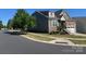A two-story house with green and brown panels and landscaping on a sunny day at 1605 Appledale Ct # 116, Fort Mill, SC 29715
