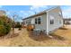 Exterior view of the house with a wooden deck and a well-manicured lawn at 1605 Appledale Ct # 116, Fort Mill, SC 29715