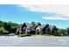 Attractive community clubhouse featuring a craftsman-style design, ample parking, and well-maintained landscaping at 1605 Appledale Ct # 116, Fort Mill, SC 29715