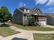Two-story home with stone and siding facade, a well-kept lawn, and an attached garage at 1605 Appledale Ct # 116, Fort Mill, SC 29715