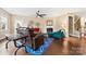 Comfortable living room features a fireplace, stylish decor, and dark hardwood floors with an eye-catching blue rug at 1605 Appledale Ct # 116, Fort Mill, SC 29715