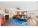 Spacious living area featuring a fireplace, dark hardwood floors, a ceiling fan, and an open layout to the kitchen at 1605 Appledale Ct # 116, Fort Mill, SC 29715