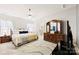 Relaxing main bedroom suite with decorative wood furniture and large rug at 1605 Appledale Ct # 116, Fort Mill, SC 29715
