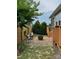 Private brick patio featuring a fire pit, seating, and a charming bamboo fence at 1605 Appledale Ct # 116, Fort Mill, SC 29715