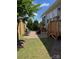 Back patio with seating area, fire pit, wooden steps, and views of the landscaped backyard at 1605 Appledale Ct # 116, Fort Mill, SC 29715