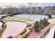 Scenic view of the community tennis courts surrounded by lush landscaping and walking paths at 1605 Appledale Ct # 116, Fort Mill, SC 29715