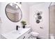 Bathroom showcases modern fixtures, a sleek vanity, and shower with decorative wall art at 1721 Edgewater Dr, Charlotte, NC 28210