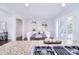 Bright dining room with a wooden table, elegant chairs, and a view of the backyard through glass doors at 1721 Edgewater Dr, Charlotte, NC 28210