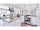 Open-concept kitchen with stainless steel appliances and a view into the living room at 1721 Edgewater Dr, Charlotte, NC 28210