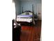 Charming bedroom with hardwood floors and a four-poster bed at 1724 Lowder St, Albemarle, NC 28001