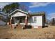 White sided home with brick base and covered porch at 1724 Lowder St, Albemarle, NC 28001