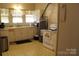 Galley kitchen with ample counter space and vintage appliances at 1724 Lowder St, Albemarle, NC 28001