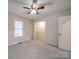 Well-lit bedroom with ceiling fan and closet at 177 Jim Hanna Ln # 4510, Wadesboro, NC 28170