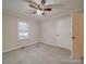 Bedroom with ceiling fan, window, and neutral carpet at 177 Jim Hanna Ln # 4510, Wadesboro, NC 28170