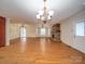 Open dining area with hardwood floors and chandelier at 177 Jim Hanna Ln # 4510, Wadesboro, NC 28170