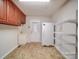 Laundry room with cabinets, shelving and tiled floor at 177 Jim Hanna Ln # 4510, Wadesboro, NC 28170