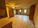 Unfinished basement with tile floor and ceiling fan at 190 Nine Patch Ln, Taylorsville, NC 28681