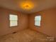 Well lit bedroom with neutral walls and carpet flooring at 190 Nine Patch Ln, Taylorsville, NC 28681