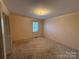 Simple bedroom with carpet flooring and a window at 190 Nine Patch Ln, Taylorsville, NC 28681