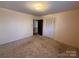 Spacious bedroom featuring carpet floors and built-in closet at 190 Nine Patch Ln, Taylorsville, NC 28681