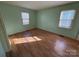 Bedroom with light walls and laminate wood flooring at 190 Nine Patch Ln, Taylorsville, NC 28681