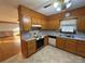 Wood kitchen cabinets, tile flooring, and an eat-in kitchen area at 190 Nine Patch Ln, Taylorsville, NC 28681