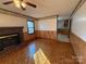 Living room with hardwood floors and a brick fireplace at 190 Nine Patch Ln, Taylorsville, NC 28681