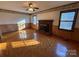 Living room with hardwood floors and a brick fireplace at 190 Nine Patch Ln, Taylorsville, NC 28681