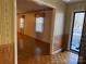 Living room with wood floors, wallpaper, and a view of the exterior at 190 Nine Patch Ln, Taylorsville, NC 28681