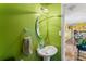 Clean bathroom with pedestal sink and green walls at 1968 12Th Street Ne Pl, Hickory, NC 28601