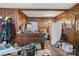 Kitchen area with wood paneling and refrigerator at 1968 12Th Street Ne Pl, Hickory, NC 28601