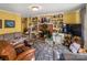 Living room with built-in shelving, fireplace, and large TV at 1968 12Th Street Ne Pl, Hickory, NC 28601