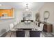 Spacious dining area with large concrete table and modern chairs at 19773 Deer Valley Dr, Cornelius, NC 28031