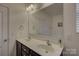 Bathroom featuring a double sink vanity, framed mirror, and modern fixtures at 2001 Yellow Daisy Dr, Matthews, NC 28104