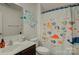 bathroom with colorful fish shower curtain, blue polka-dot wall decorations, and vanity at 2001 Yellow Daisy Dr, Matthews, NC 28104