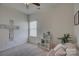 Bright bedroom featuring a cozy seating area and natural light from a large window at 2001 Yellow Daisy Dr, Matthews, NC 28104