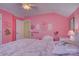 Pink bedroom featuring unicorn decor, creating a whimsical and cheerful space at 2001 Yellow Daisy Dr, Matthews, NC 28104