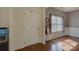 Bright foyer with hardwood floors and a view of the living spaces at 2001 Yellow Daisy Dr, Matthews, NC 28104