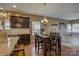 Kitchen and dining area with granite countertops, pendant lighting, and wood cabinets at 2001 Yellow Daisy Dr, Matthews, NC 28104