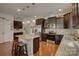 Charming kitchen featuring stainless steel appliances, granite countertops, and a breakfast bar at 2001 Yellow Daisy Dr, Matthews, NC 28104