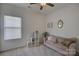 Bright living room with neutral tones, plush seating, and a decorative ceiling fan at 2001 Yellow Daisy Dr, Matthews, NC 28104