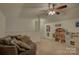 Spacious playroom with a couch, ' toys, ceiling fan and natural light at 2001 Yellow Daisy Dr, Matthews, NC 28104