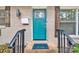 Teal front door with black metal railing and welcome mat at 2025 Ibis Ct, Charlotte, NC 28205