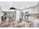 Modern kitchen with stainless steel appliances and glass dining table at 2025 Ibis Ct, Charlotte, NC 28205