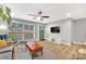 Living room with hardwood floors, green door, and ceiling fan at 2025 Ibis Ct, Charlotte, NC 28205