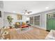 Living room with hardwood floors, green door, and ceiling fan at 2025 Ibis Ct, Charlotte, NC 28205