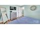 Bedroom with a queen-size bed, full-length mirror, and built-in dresser at 2027 Ibis Ct, Charlotte, NC 28205