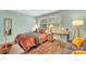 Charming bedroom with a full-size bed, workspace, and a sitting area at 2027 Ibis Ct, Charlotte, NC 28205